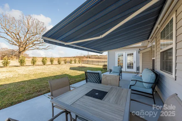 a view of balcony with couch and wooden floor
