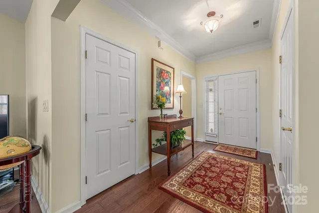 a view of room with furniture and wooden floor