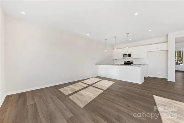 a view of kitchen with wooden floor