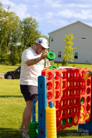 a view of swimming pool with a yard