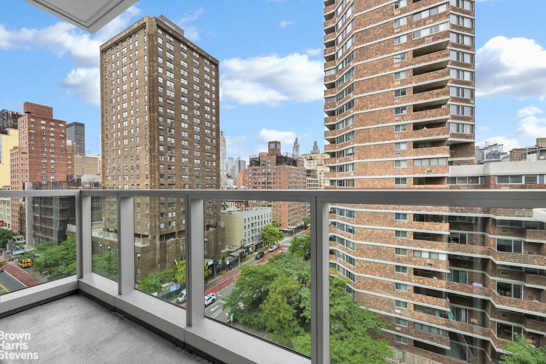 300 East 23rd Street, Unit 9B Manhattan, NY 10010 - Photo 2 of 14 a view of balcony with a floor to ceiling window next to a tall building