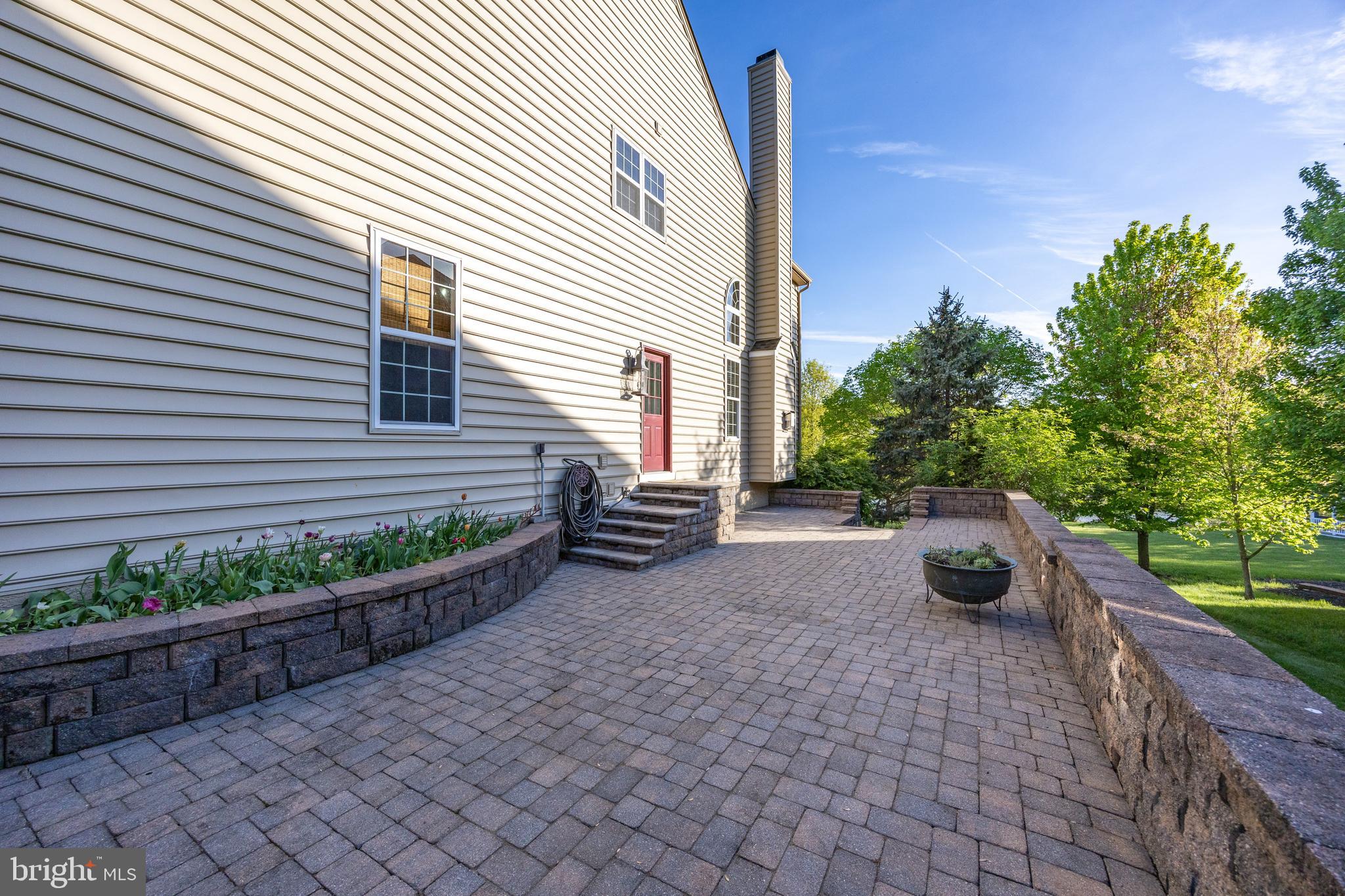 912 Nottingham Road Pottstown, PA 19465 - Photo 86 of 92 Side patio w/tulip garden & laundry room entrance
