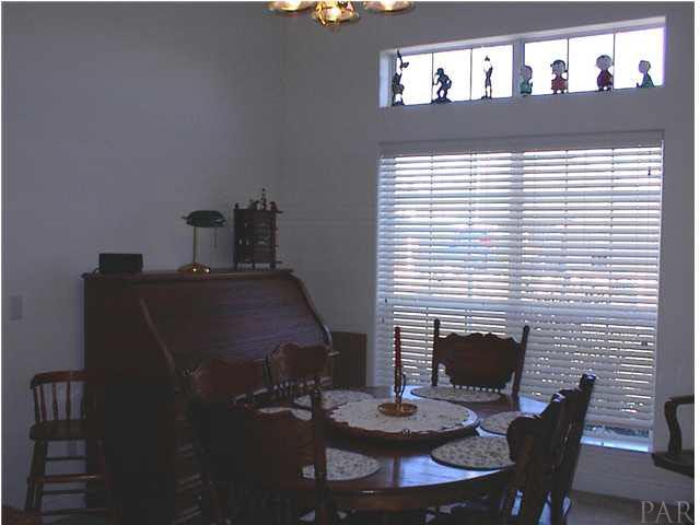 7477 Farmers Road Pensacola, FL 32526 - Photo 11 of 17 Spacious Dining Room with Transom Window