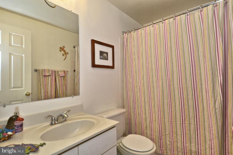 1544 Deer Point Way Reston, VA 20194 - Photo 14 of 27 a bathroom with a sink toilet and shower