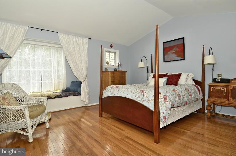 1544 Deer Point Way Reston, VA 20194 - Photo 22 of 27 a bedroom with a bed and wooden floor