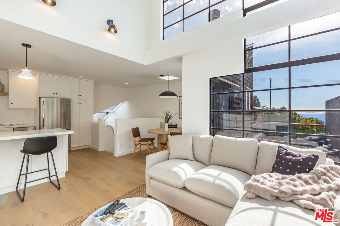 a living room with furniture and a rug