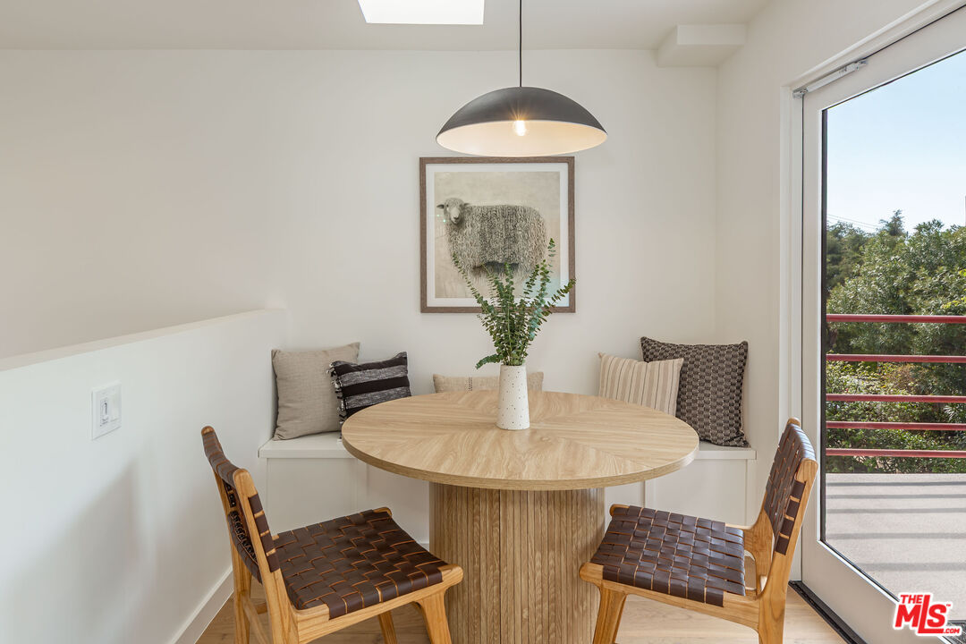 29233 Heathercliff Road, Unit 2 Malibu, CA 90265 - Photo 13 of 20 a dining room with furniture and window