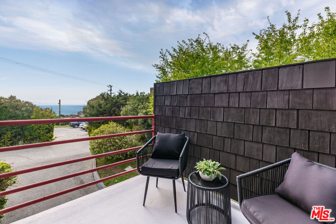 29233 Heathercliff Road, Unit 2 Malibu, CA 90265 - Photo 14 of 20 a view of a bench in back yard of a house