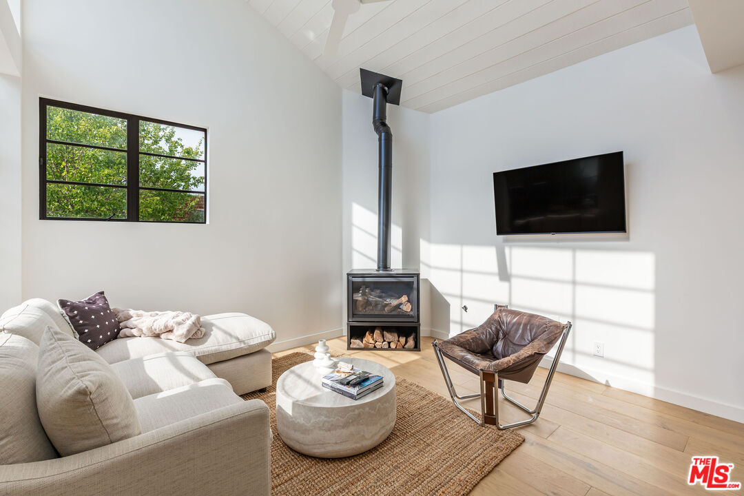 29233 Heathercliff Road, Unit 2 Malibu, CA 90265 - Photo 2 of 20 a living room with furniture and a flat screen tv