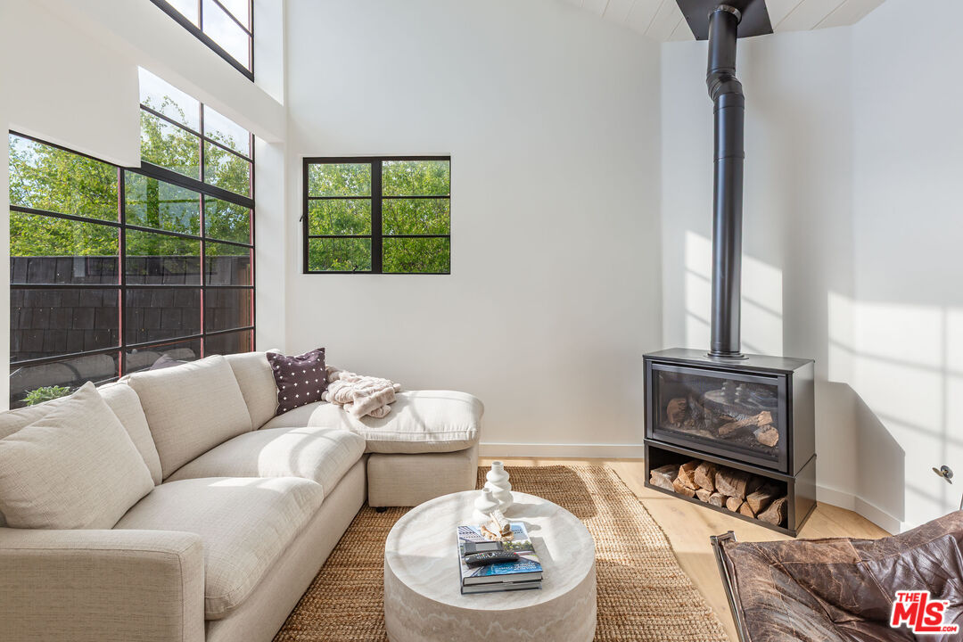 29233 Heathercliff Road, Unit 2 Malibu, CA 90265 - Photo 3 of 20 a living room with furniture and a window