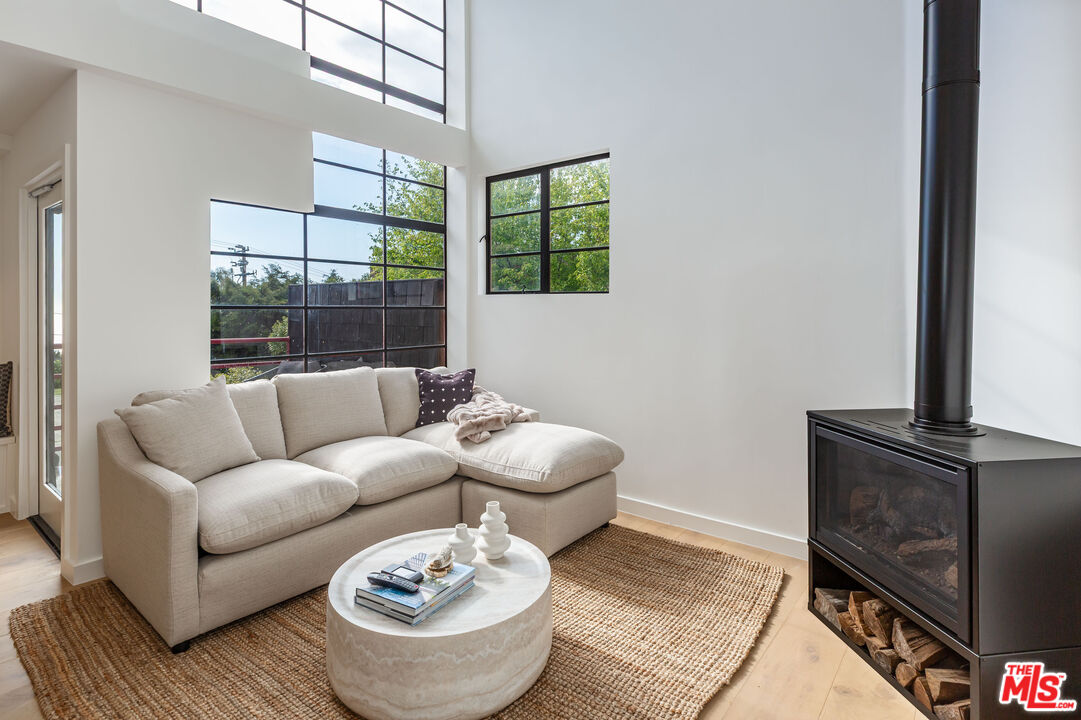 29233 Heathercliff Road, Unit 2 Malibu, CA 90265 - Photo 4 of 20 a living room with furniture and a window