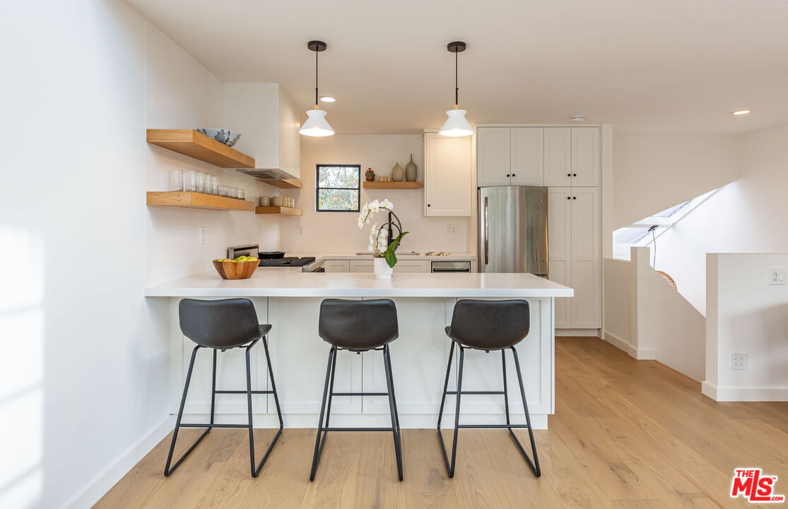 29233 Heathercliff Road, Unit 2 Malibu, CA 90265 - Photo 6 of 20 a view of kitchen with cabinets and wooden floor