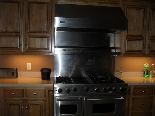 3330 Maxie Jones Road Springfield, TN 37172 - Photo 6 of 20 Impressive kitchen says it all with stunning cabinets and corian countertops. Viking stove with double oven and griddle, along with warming rack under the hood. Cabinetry Sub Zero fridge, Bosch dishwasher and Convection oven/microwave.