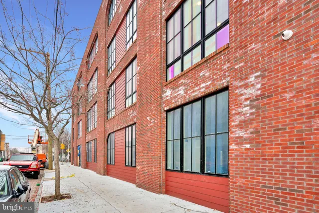 a view of a brick house with a large windows