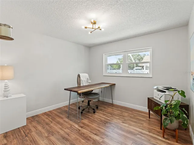 a workspace with wooden floor