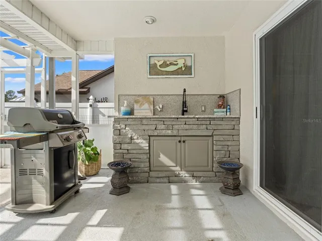 a kitchen with stainless steel appliances granite countertop a stove and a sink
