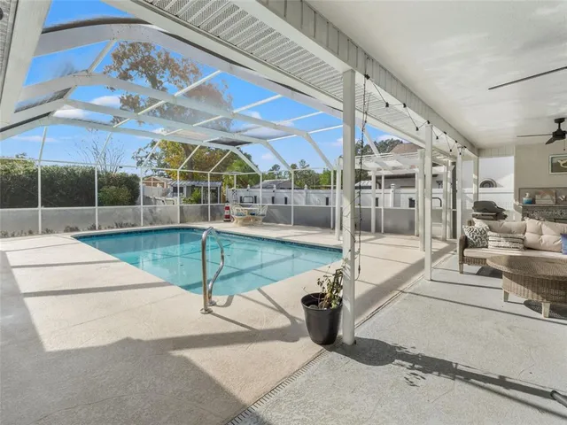 a view of a patio with a table and chairs