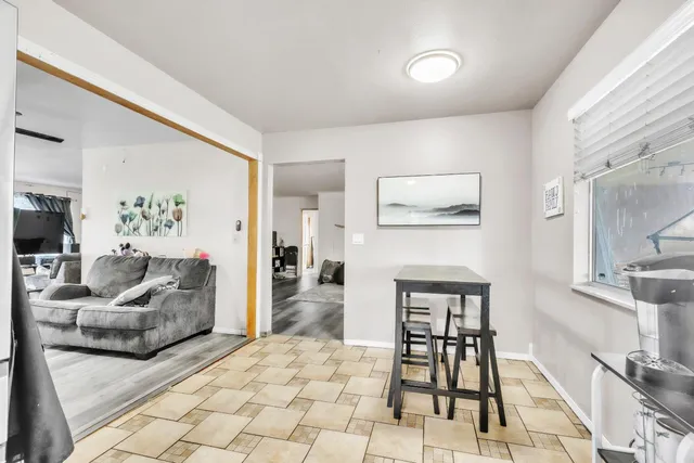 a bedroom with furniture and wooden floor