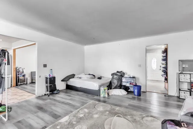 a bedroom with bed and window