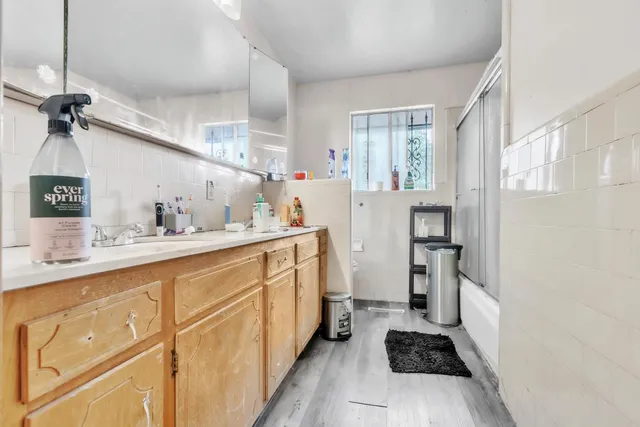 a kitchen with cabinets a sink and appliances