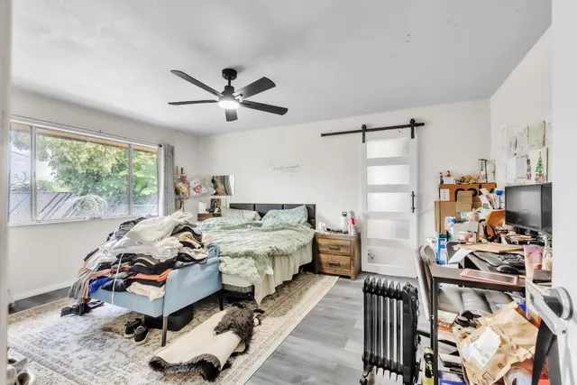 a bed room with furniture and a window