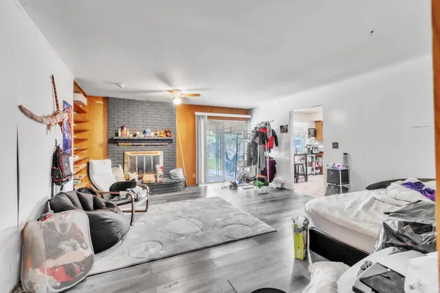 a view of a livingroom with furniture and cars