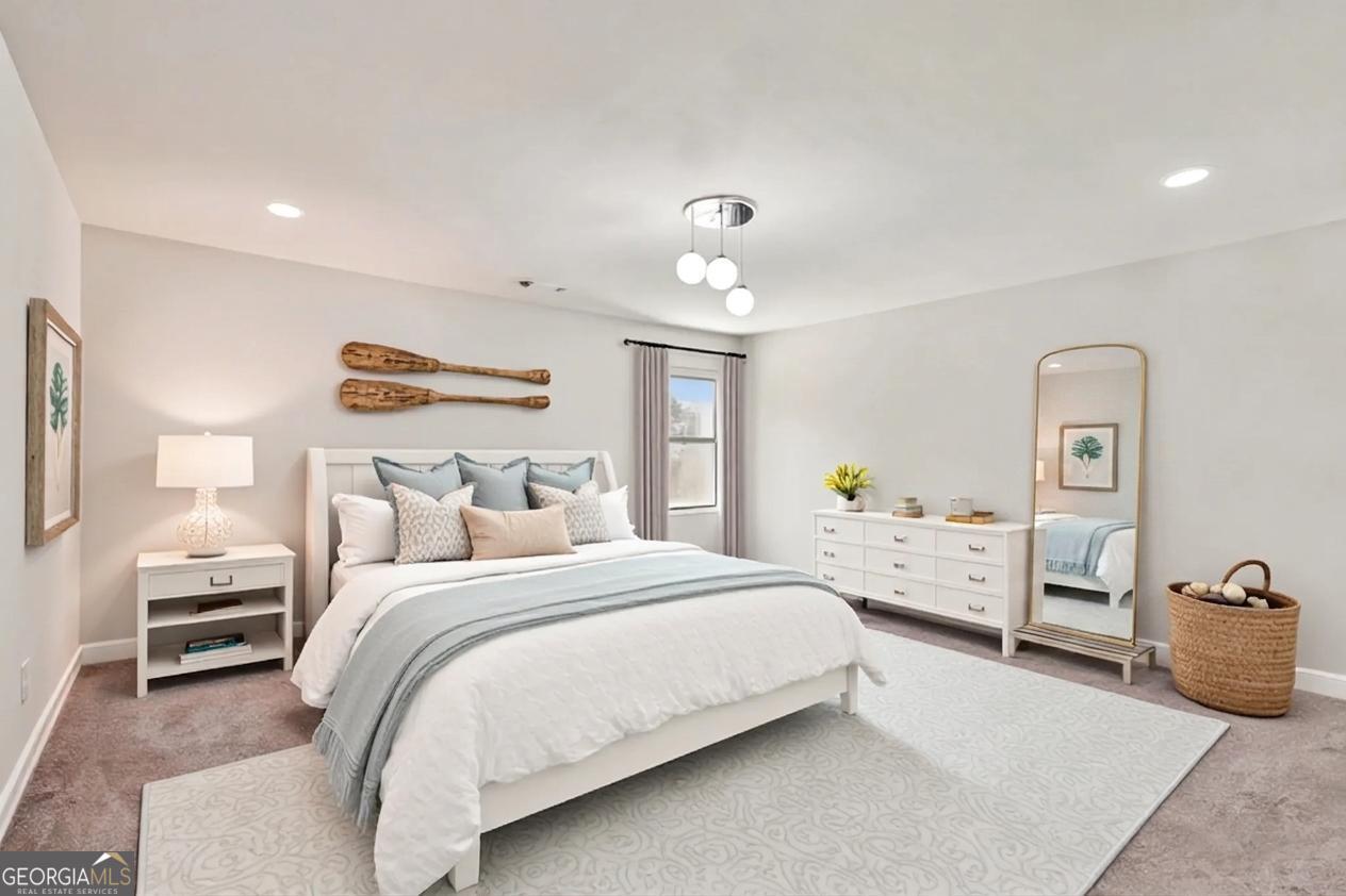 17 Lake Sydney Drive Dawsonville, GA 30534 - Photo 20 of 52 a bedroom with a bed and ceiling fan