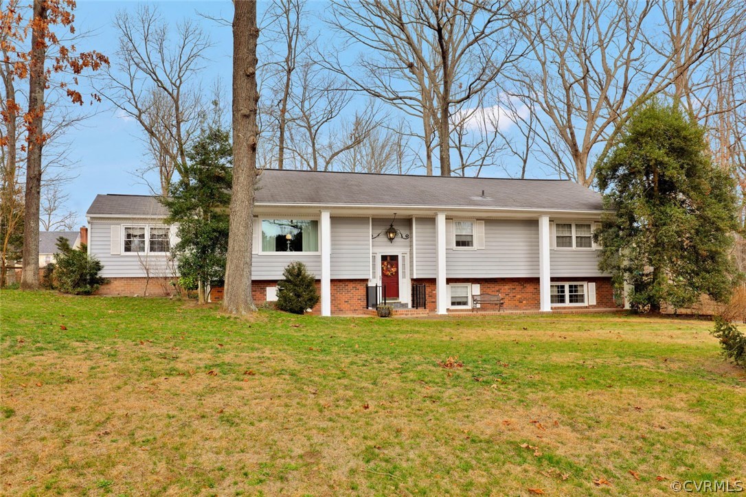 3300 Wood Dale Road Chester, VA 23831 - Photo 1 of 28 a view of a white house with a large pool and large trees