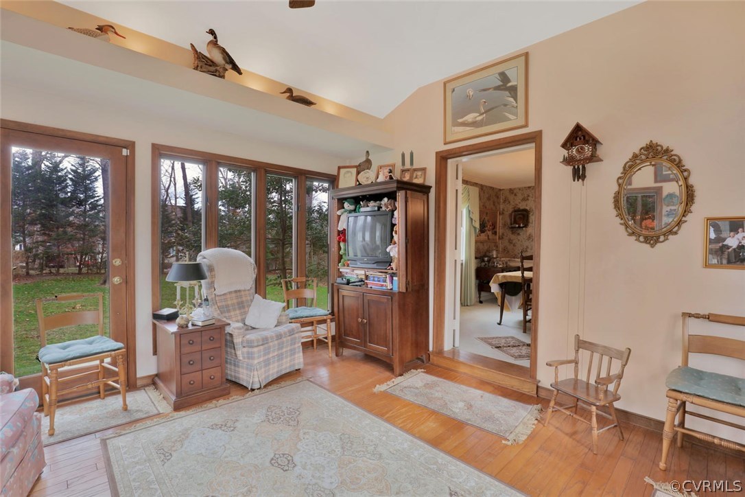 3300 Wood Dale Road Chester, VA 23831 - Photo 11 of 28 a living room with furniture a window and a chandelier