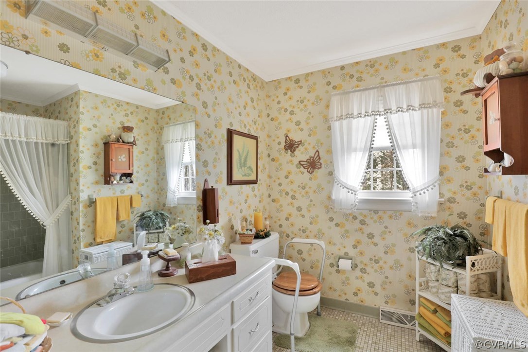 3300 Wood Dale Road Chester, VA 23831 - Photo 13 of 28 a bathroom with a toilet sink and mirror