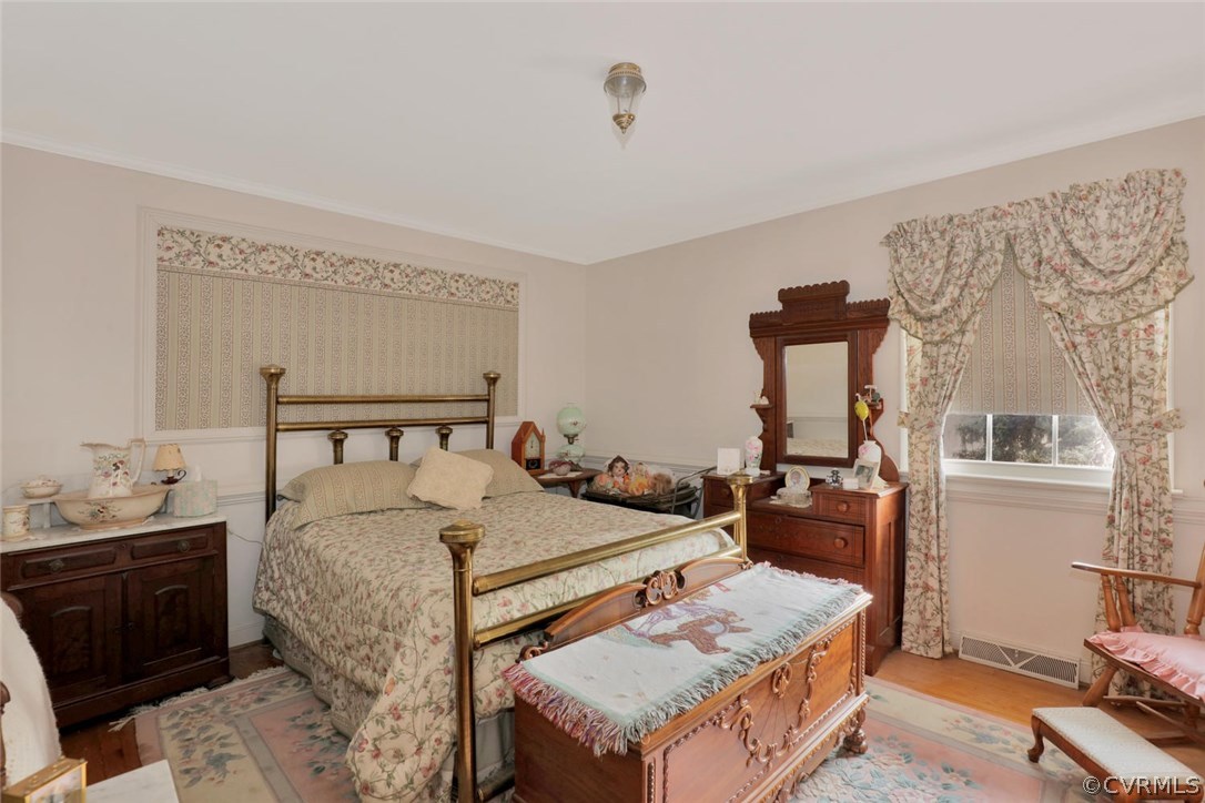 3300 Wood Dale Road Chester, VA 23831 - Photo 14 of 28 a bedroom with a bed and a dresser in it