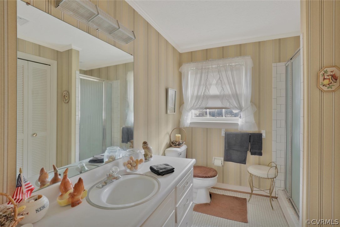 3300 Wood Dale Road Chester, VA 23831 - Photo 17 of 28 a bathroom with a sink a toilet and mirror