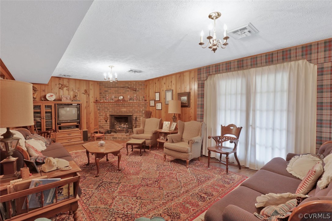 3300 Wood Dale Road Chester, VA 23831 - Photo 19 of 28 a living room with furniture and a fireplace