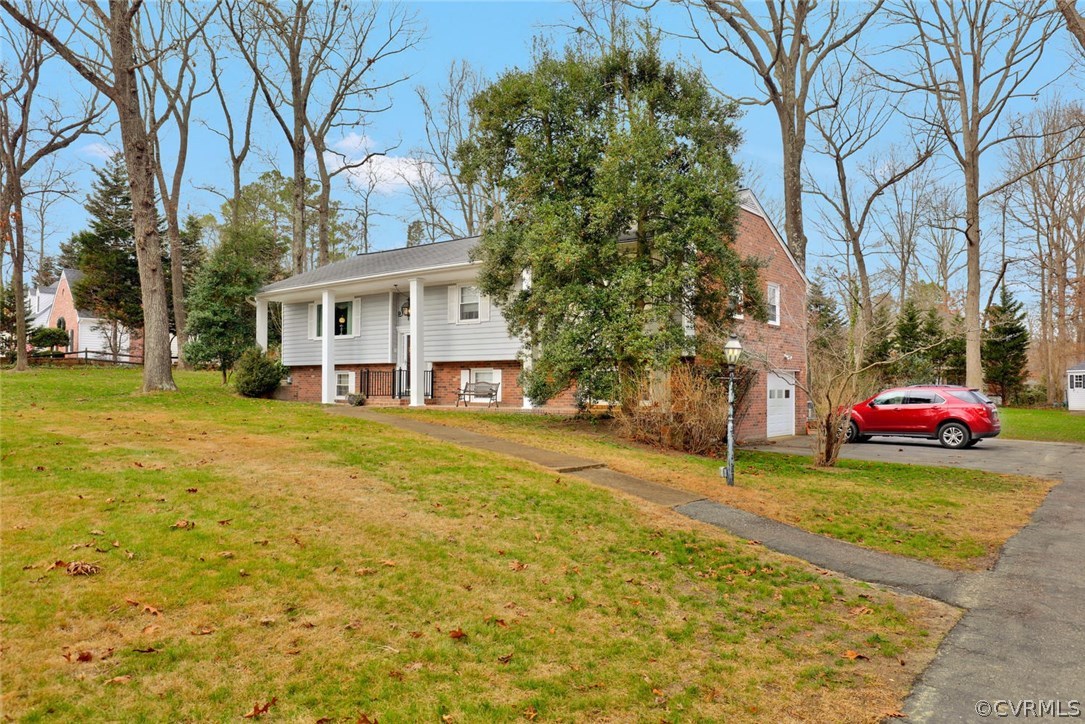 3300 Wood Dale Road Chester, VA 23831 - Photo 23 of 28 a house view with a garden space