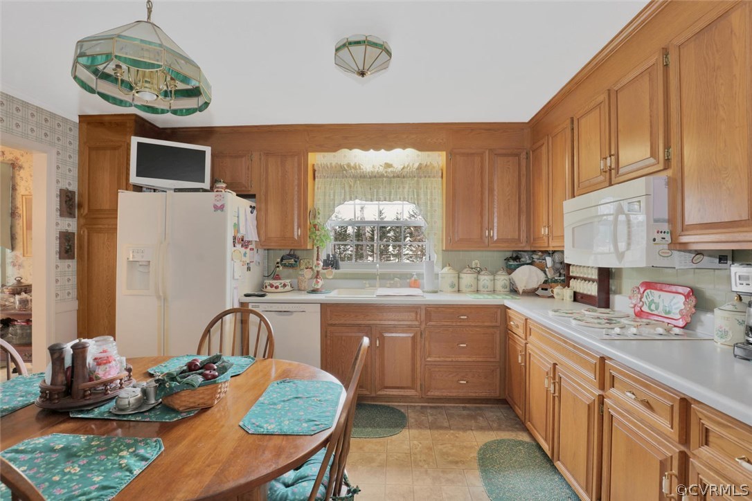 3300 Wood Dale Road Chester, VA 23831 - Photo 8 of 28 a kitchen with stainless steel appliances granite countertop a sink a stove and a refrigerator