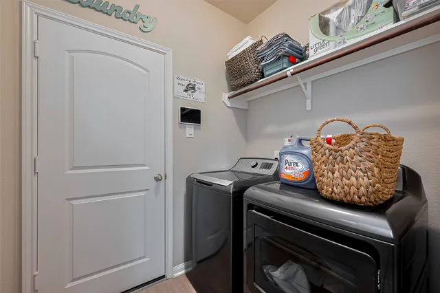 a utility room with dryer and washer