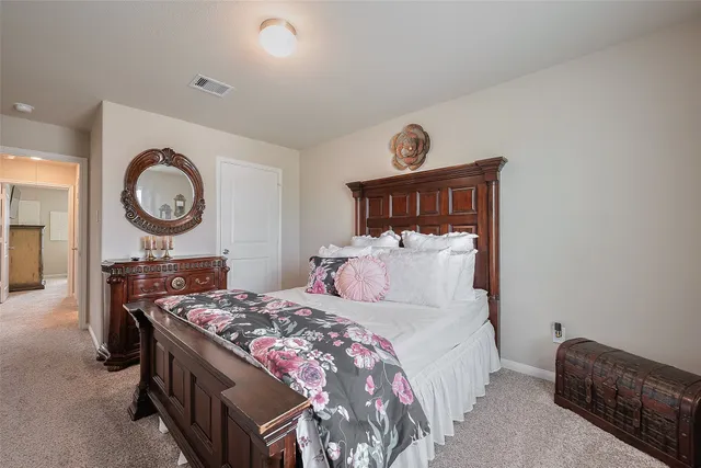 a bed room with a bed and a lamp