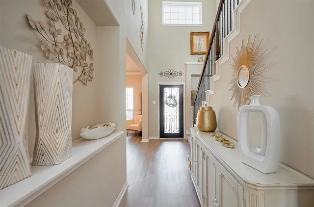 a bathroom with a granite countertop sink a toilet and a mirror