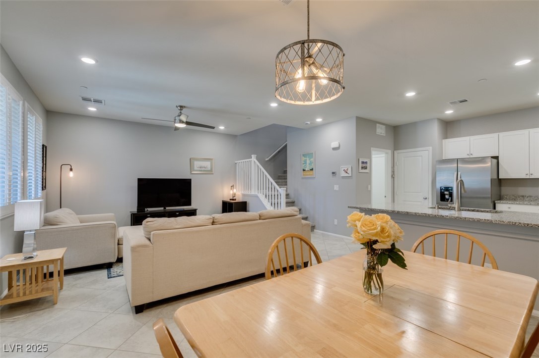 2870 Turnstone Ridge Street Henderson, NV 89044 - Photo 19 of 50 Dining area featuring light tile patterned floors, stairway, recessed lighting, ceiling fan, and baseboards