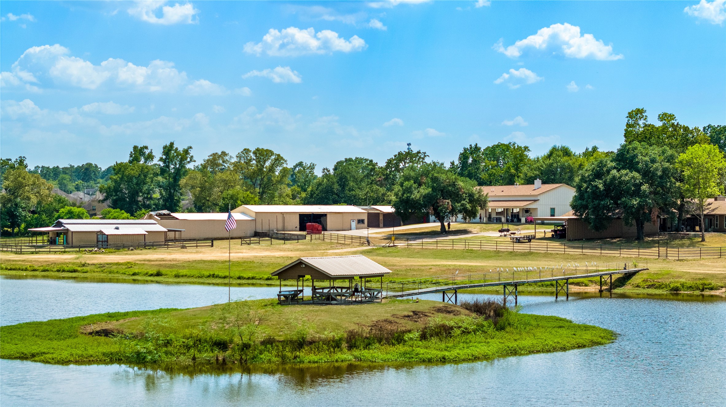 41115 Community Road Magnolia, TX 77354 - Photo 11 of 28 a view of a swimming pool with an outdoor seating and a garden