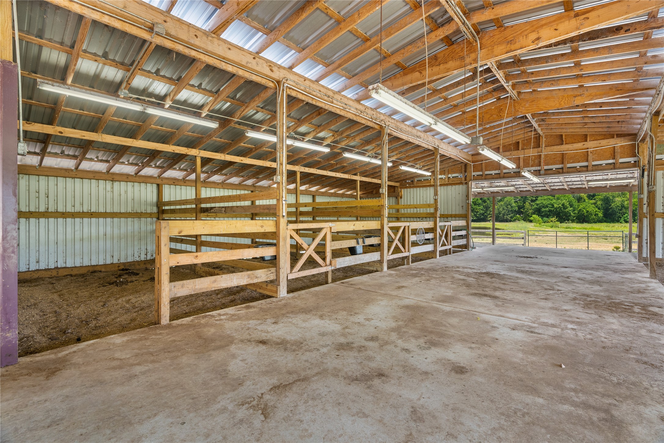 41115 Community Road Magnolia, TX 77354 - Photo 15 of 28 a view of an empty room with wooden walls