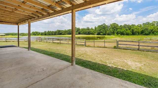 a view of a garden with an outdoor seating