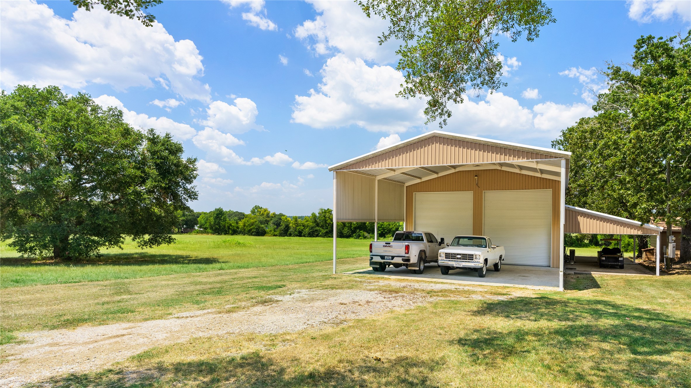 41115 Community Road Magnolia, TX 77354 - Photo 18 of 28 a view of a chair and tables in the garden and the view of houses