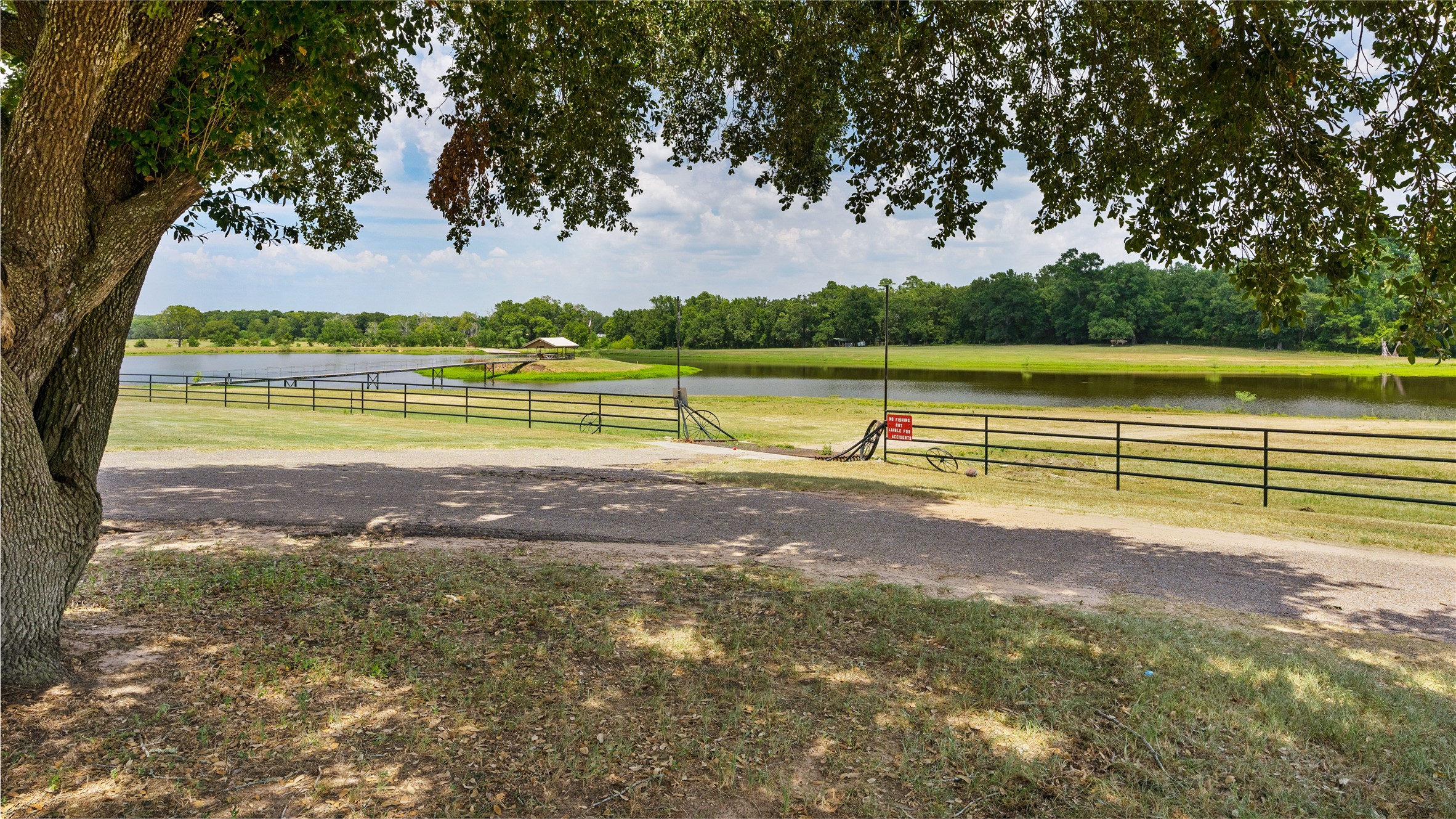 41115 Community Road Magnolia, TX 77354 - Photo 7 of 28 a view of a lake with a big yard