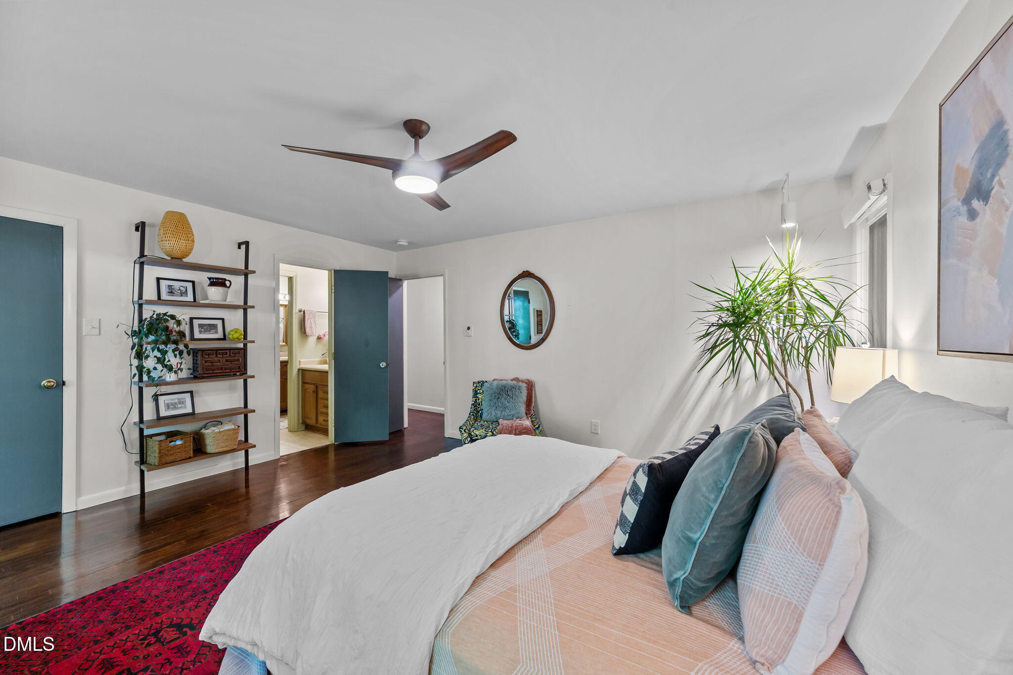 105 Barcliff Terrace Cary, NC 27518 - Photo 18 of 47 a bed room with a bed and a chandelier