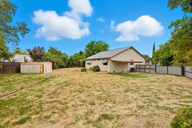 a backyard of a house with lots of green space