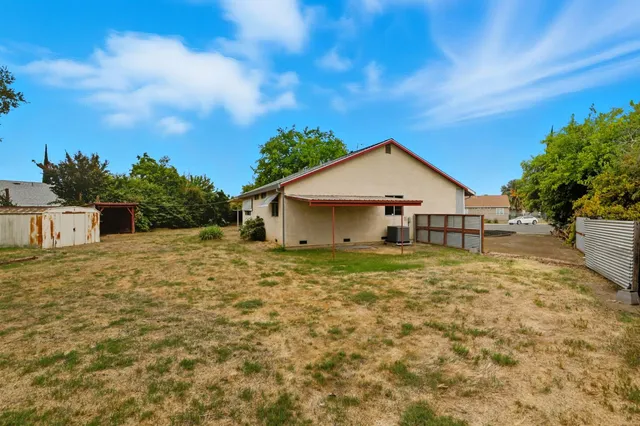 a view of backyard of a house