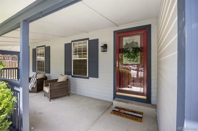 a backyard of a house with outdoor seating