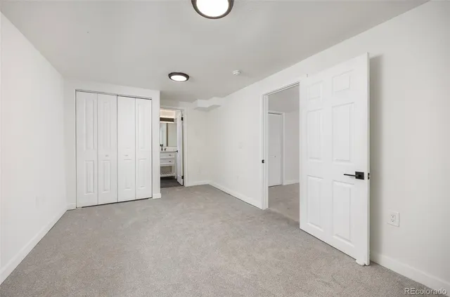 a bathroom with a toilet a sink a mirror a bathtub and vanity