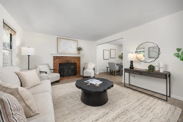 a living room with furniture a fireplace and a fireplace